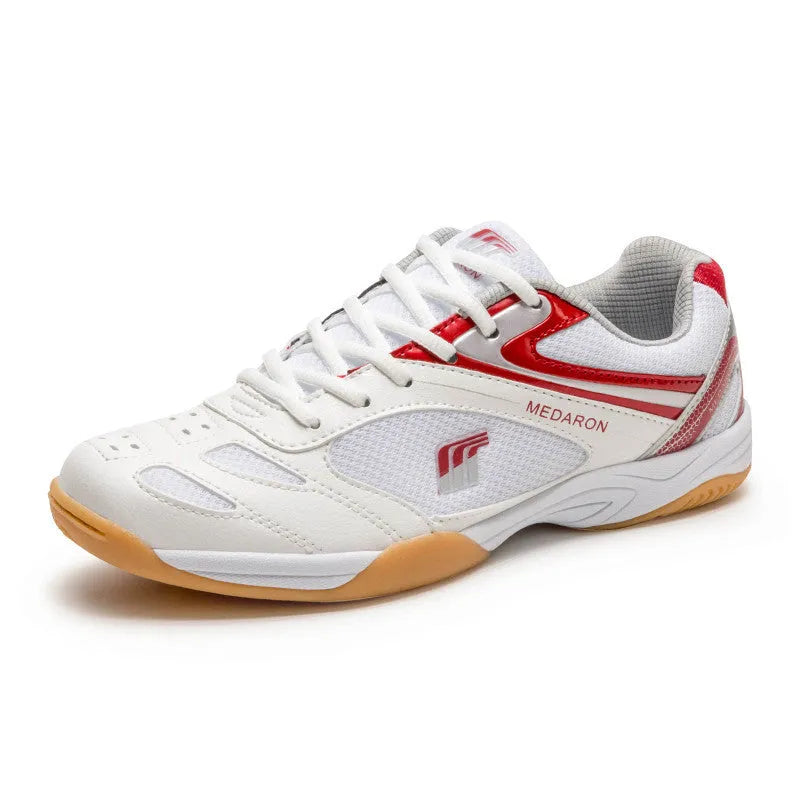 White table tennis sneakers with mesh upper and rubber sole in red or blue accents