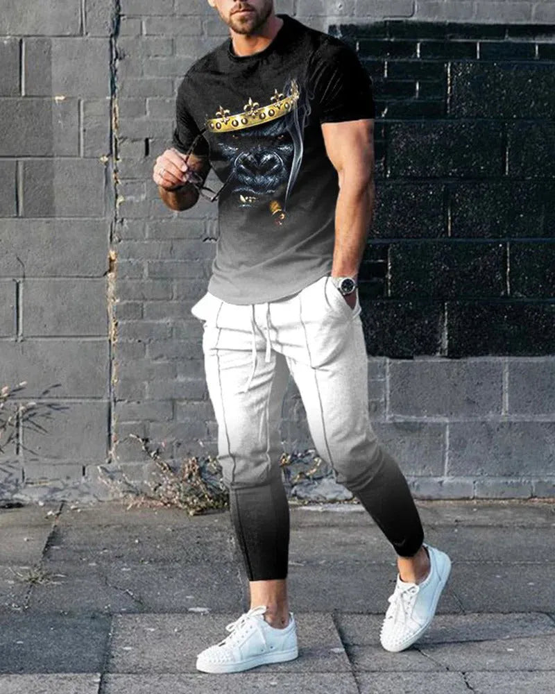 Man wearing a thin, short-sleeved printed pullover and matching trousers from a polyester blend sport suit set.