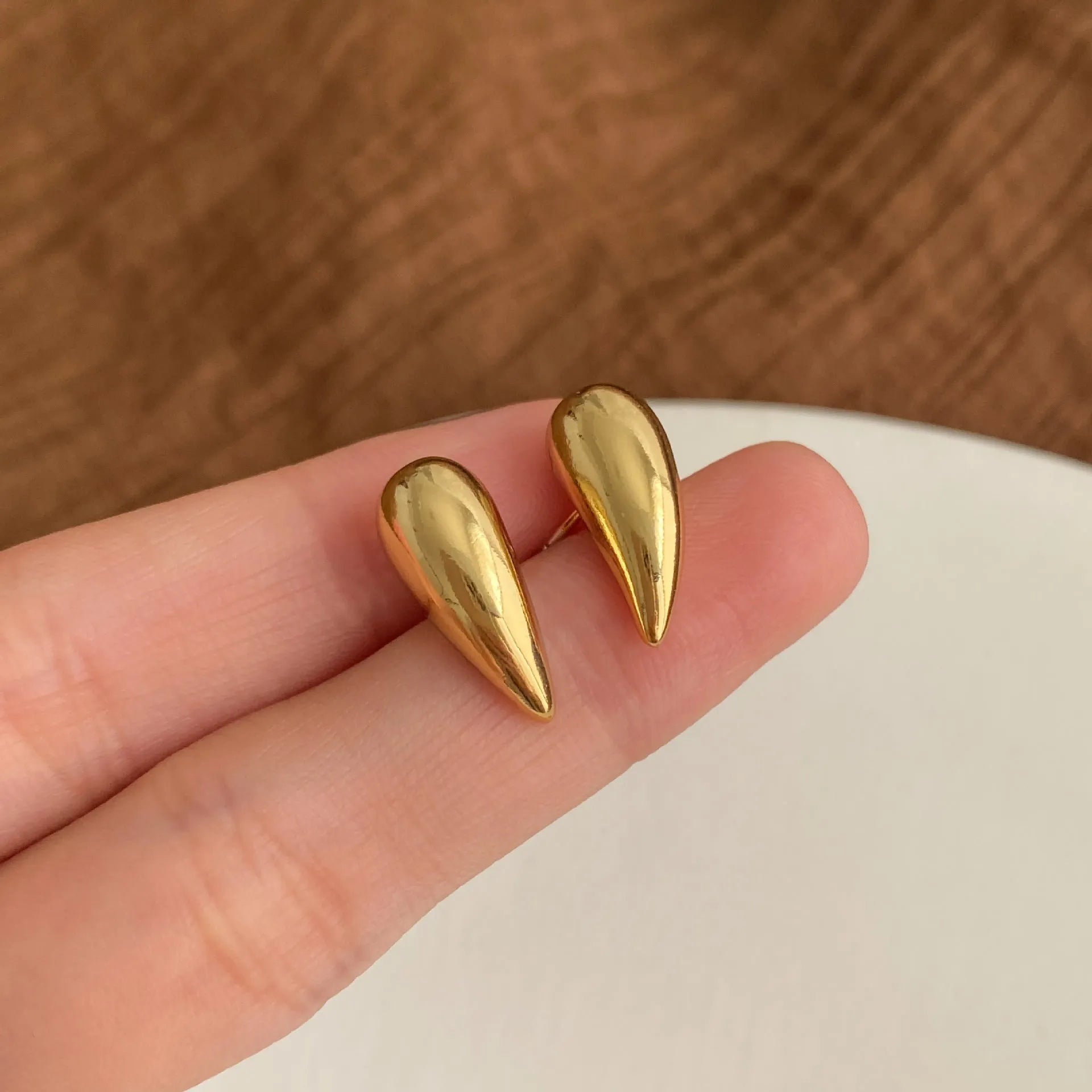 Geometric copper droplet earrings for women with electroplated finish, available as ear clips or studs