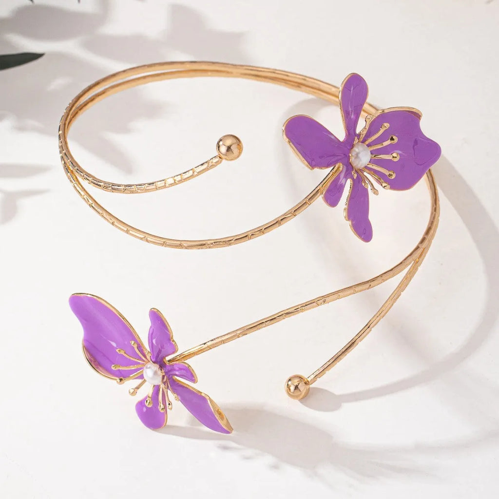 Close-up of a personalised pink alloy armband with a hollow line pattern.