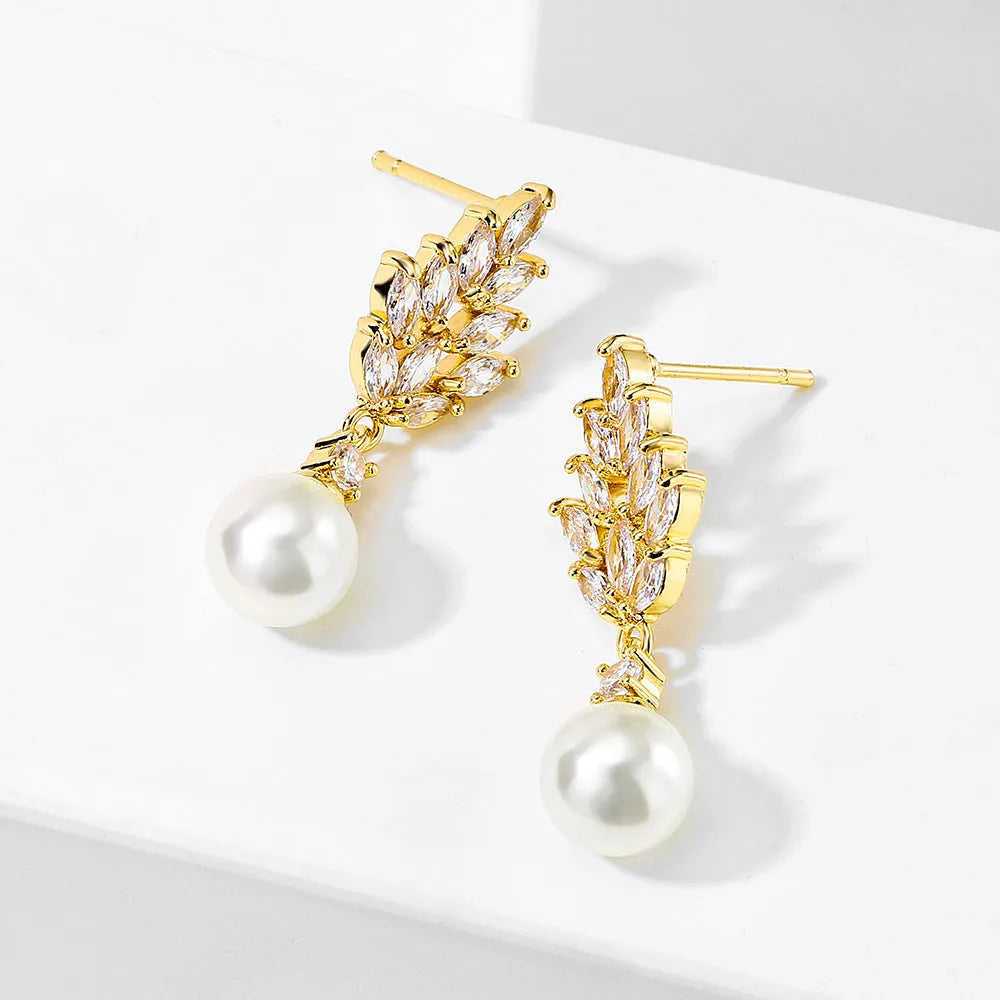 Geometric flower-shaped earrings with micro-inlaid zircon stones and pearl accents in gold, platinum, or rose gold plating.