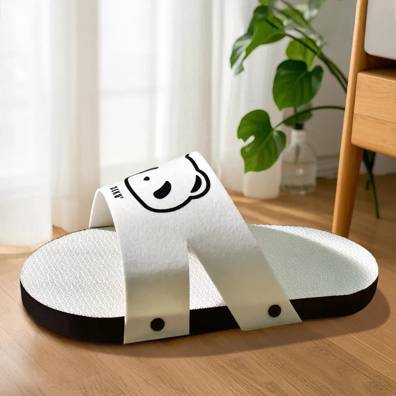 White corrugated paper cat scratch board in slipper-style design for furniture protection