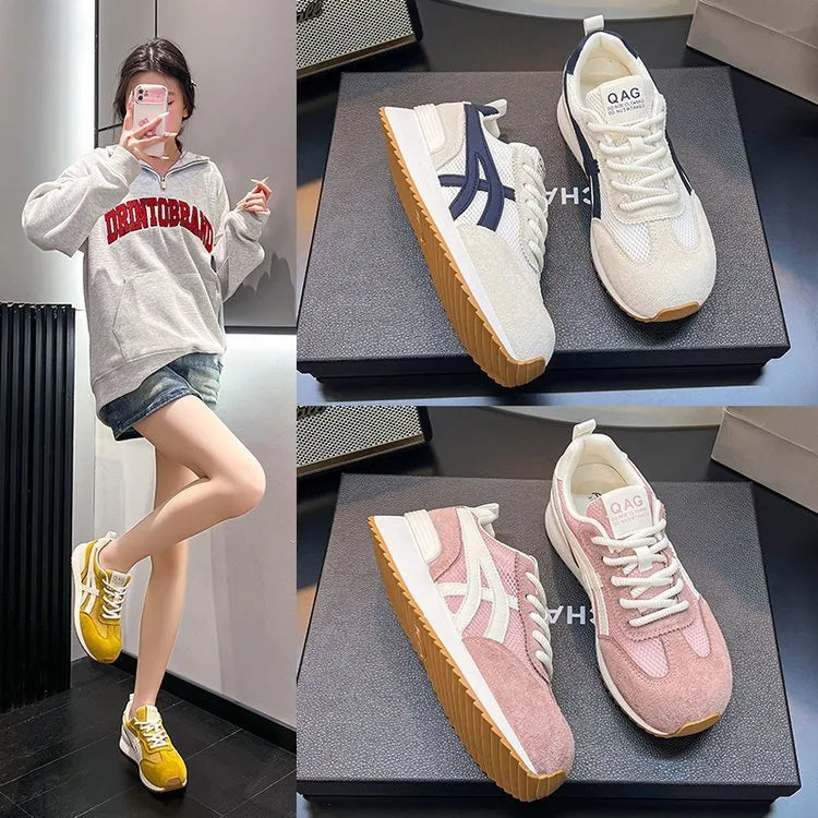 Women's white low-top lace-up sneakers with round toe on a flat plastic sole.