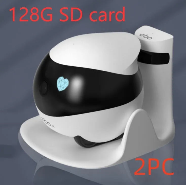 White mobile robot surveillance camera on a charging dock.