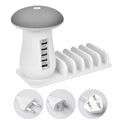 White mushroom-shaped LED light on a five-port USB charging station for phones and tablets
