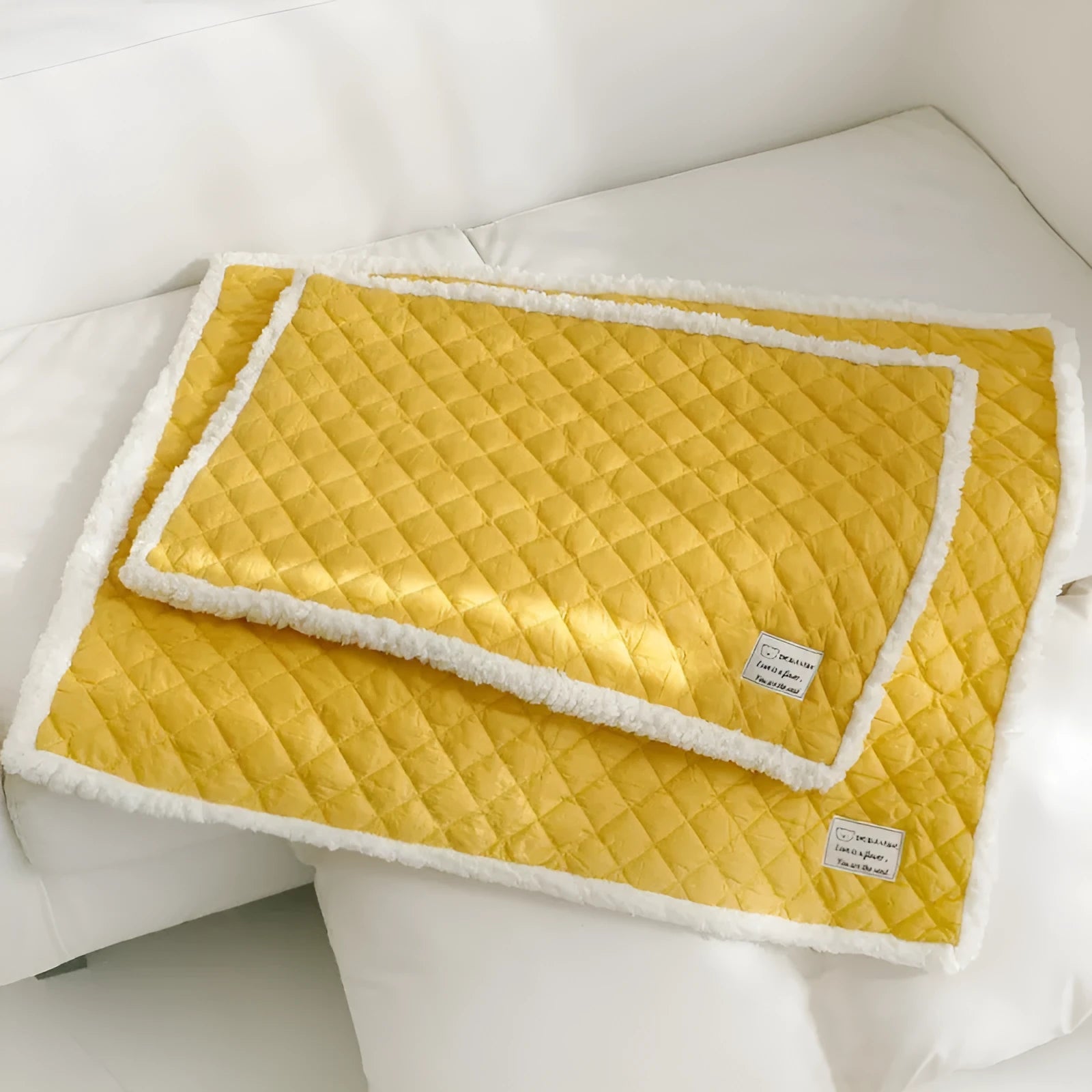 Blue quilted pet blanket for cats showing terry texture and 80x60cm large size dimensions