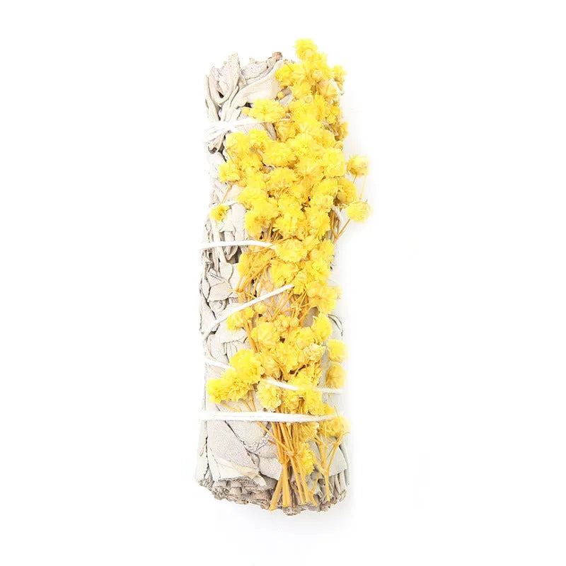 White sage and red rose petal colourful aromatherapy incense bundle on a wooden table