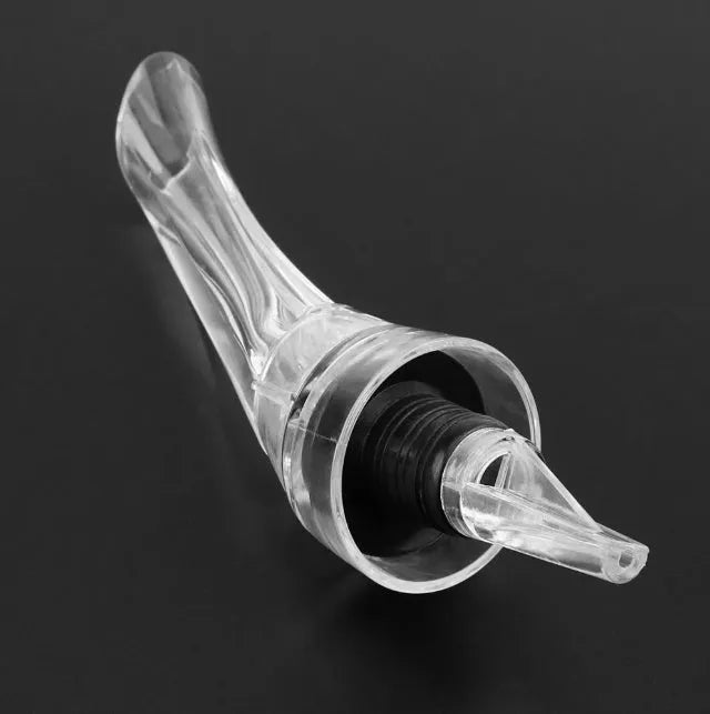 Compact clear acrylic wine aerator with a stainless steel filter inside, measuring 16cm.