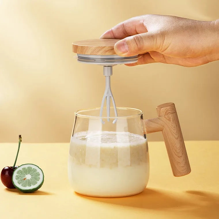 Clear borosilicate glass self-stirring coffee mug with electric base, 400ml capacity.