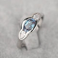 Geometric ellipse women's ring with zircon inlay in white gold finish, showing sizes 6 to 10