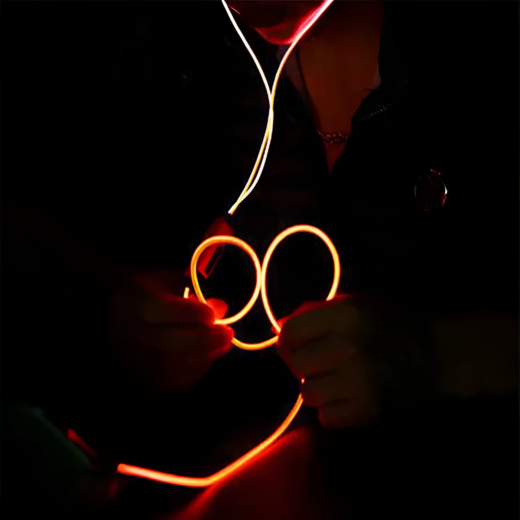 Blue LED light-up earphones with aluminium alloy shells showing rhythm-sync lighting patterns