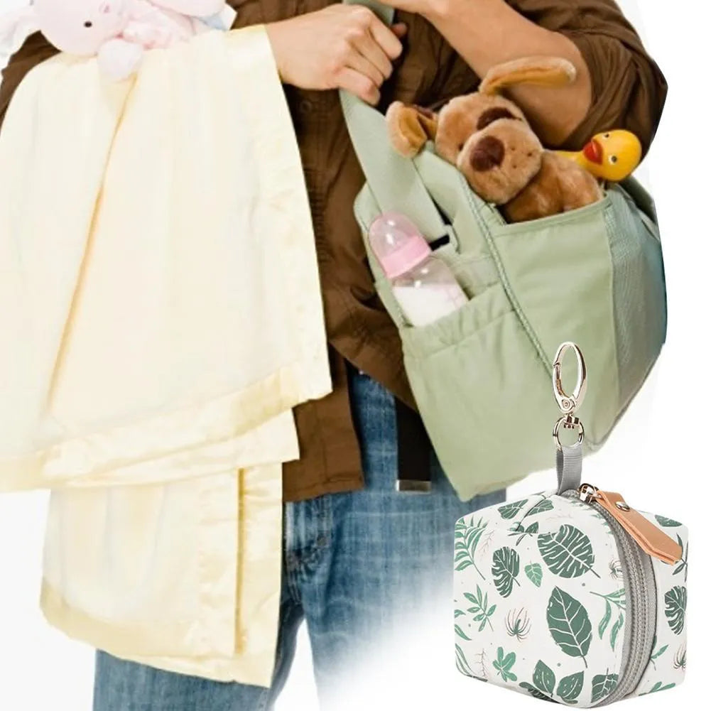 Baby pacifier holder case in PU leather with impervious nylon lining and buckle clip, holds 2 pacifiers, compact 6.35cm size