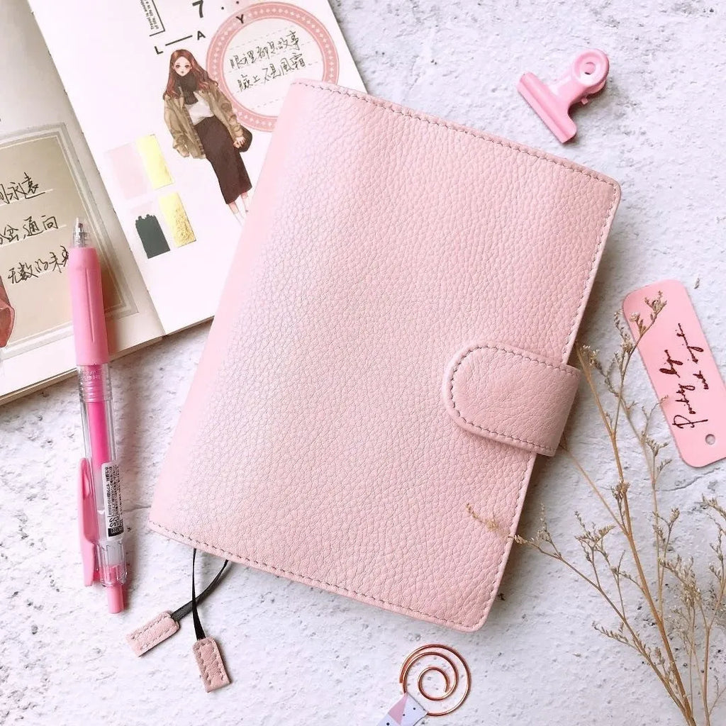 A6 size leather loose-leaf diary with a textured lychee pattern cowhide cover