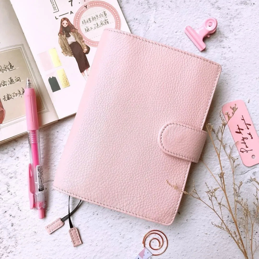 A6 size leather loose-leaf diary with a textured lychee pattern cowhide cover