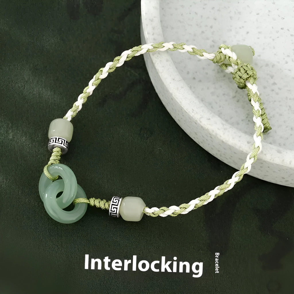 Women's copper bracelet with jade peace buckle and ethnic woven double-ring strap.
