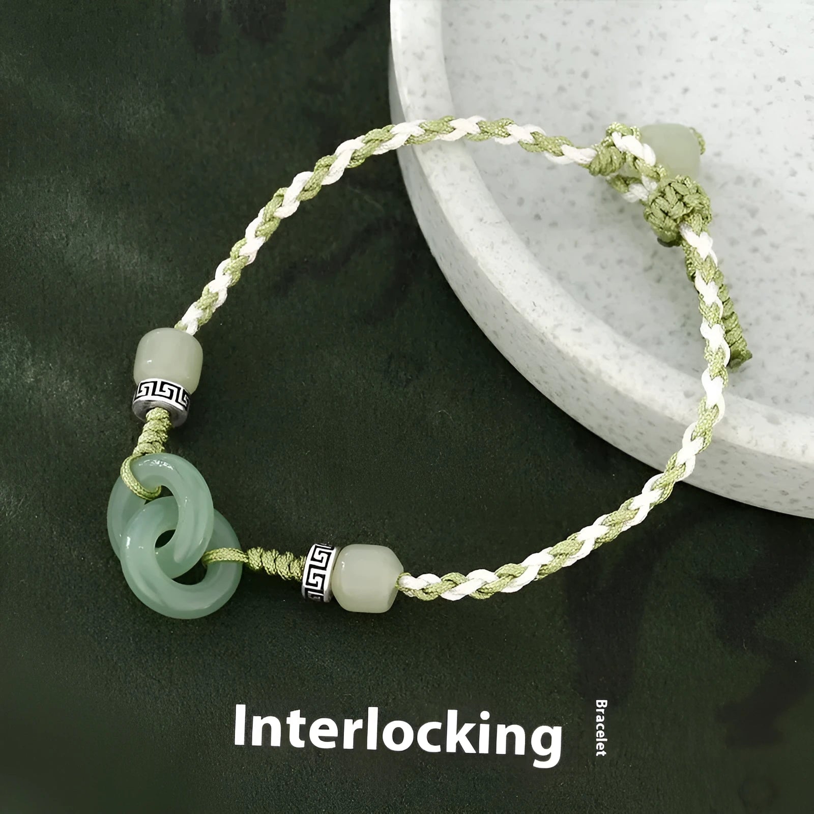 Women's copper bracelet with jade peace buckle and ethnic woven double-ring strap.