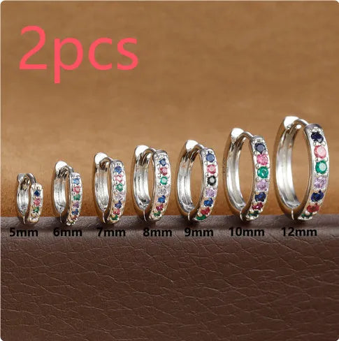 Zircon perforated stud earrings in gold, rose gold, or silver colour with geometric design