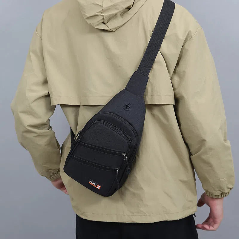 Canvas crossbody bag for men, lightweight waterproof with stitching detail, available in multiple colours