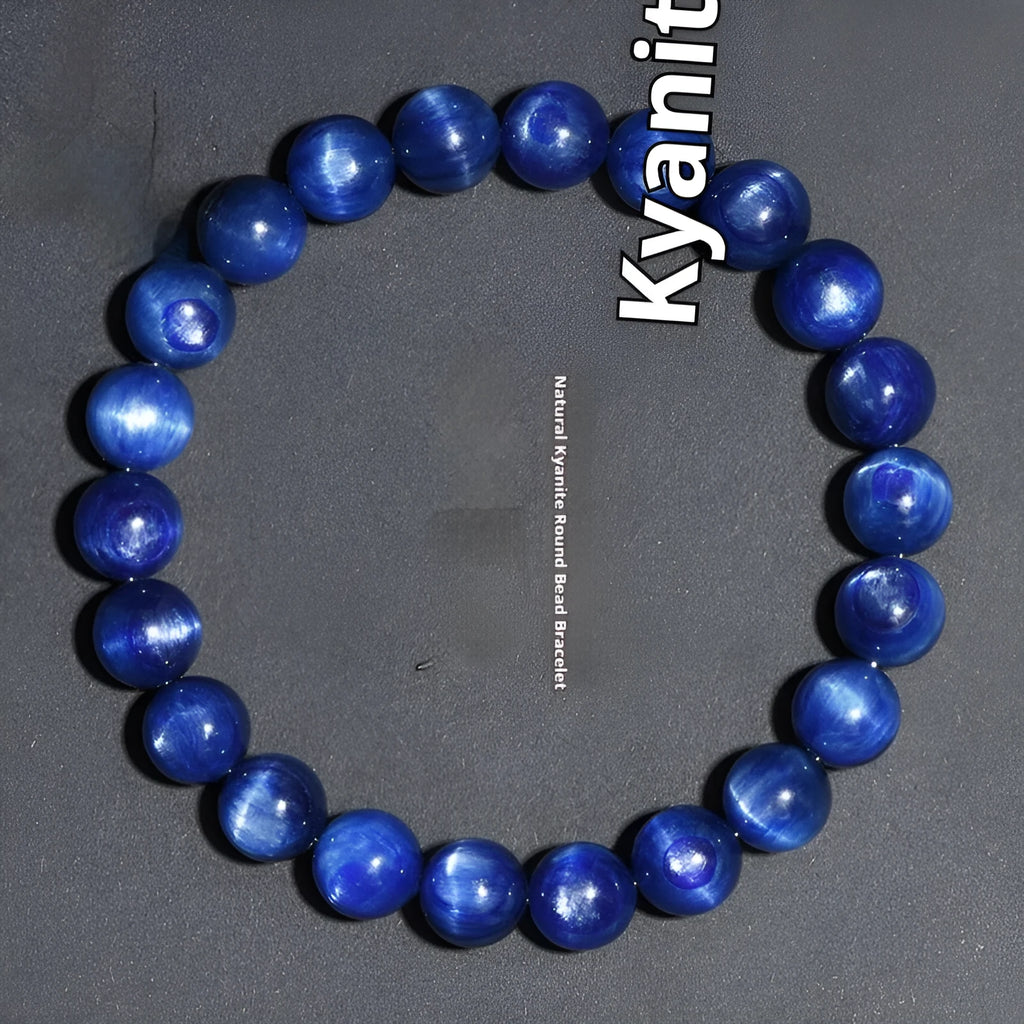 Polished blue crystal bracelet with geometric beads and Ruyi charm, shown in trade fair gifting context