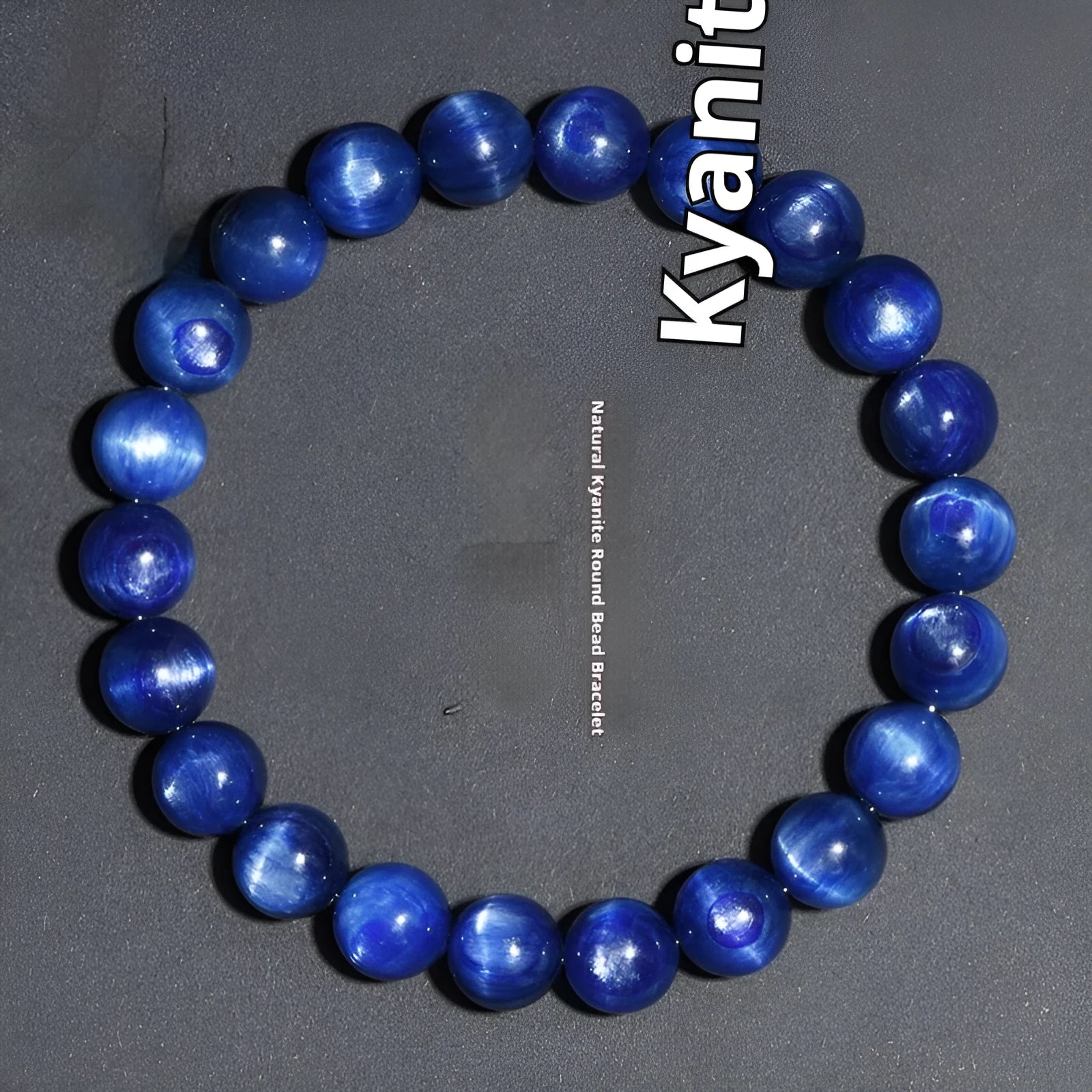 Polished blue crystal bracelet with geometric beads and Ruyi charm, shown in trade fair gifting context