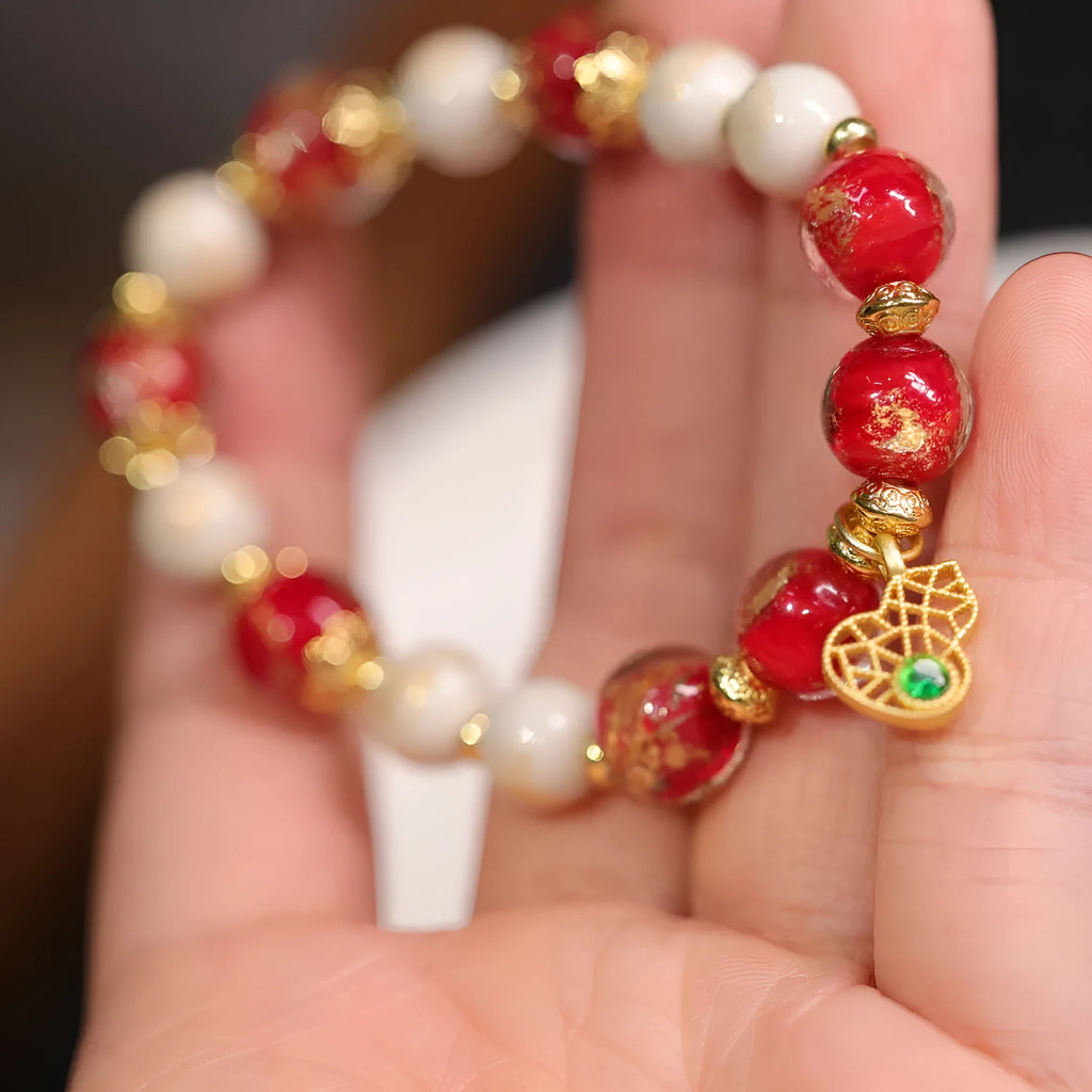 Women's ethnic bracelet with gold foil coloured glaze and geometric design