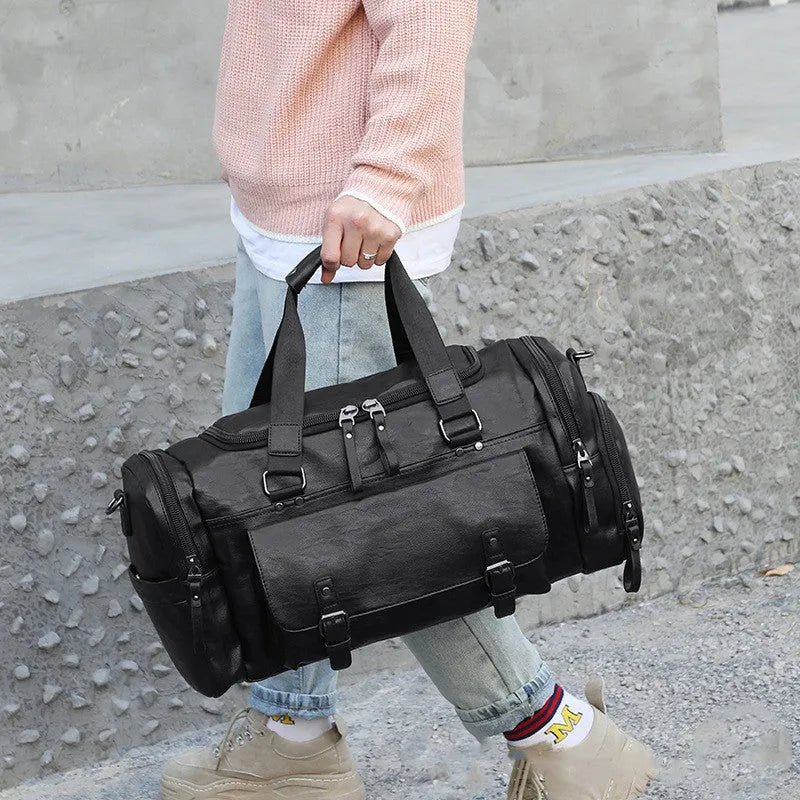 Black large capacity PU travel shoe bag with zip and removable ventilated lining.