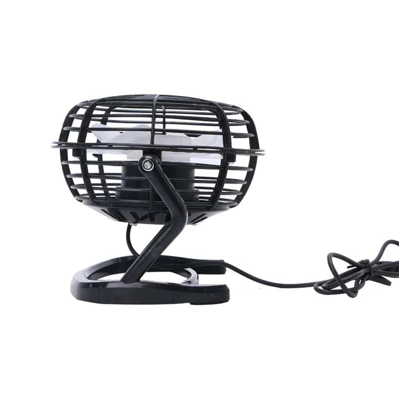 Mini portable USB desk fan with adjustable angle in black colour beside laptop