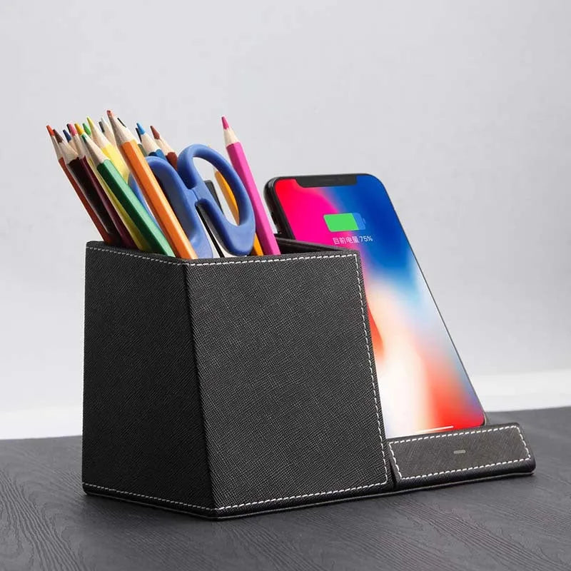 Black leather wireless charging station with pen holder compartment and phone charging surface