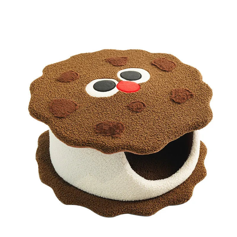 Khaki coloured enclosed cat house with circular entrance, nest-shaped like a sandwich cookie