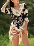 Women's apricot sun protection shirt with V-neck and hollow-out sleeves on a hanger.