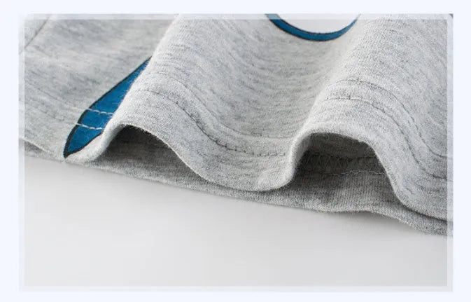 Grey children's cotton T-shirt laid flat, showing a size chart for measurements from 90cm to 140cm.