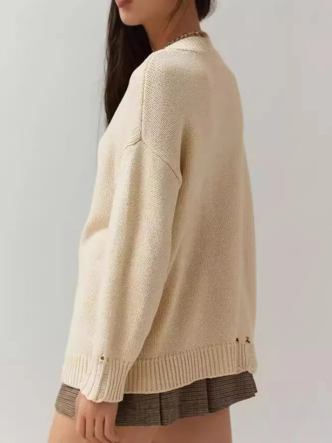 Women's milky white loose-fitting acrylic pullover sweater with round neck and Jacquard knit texture