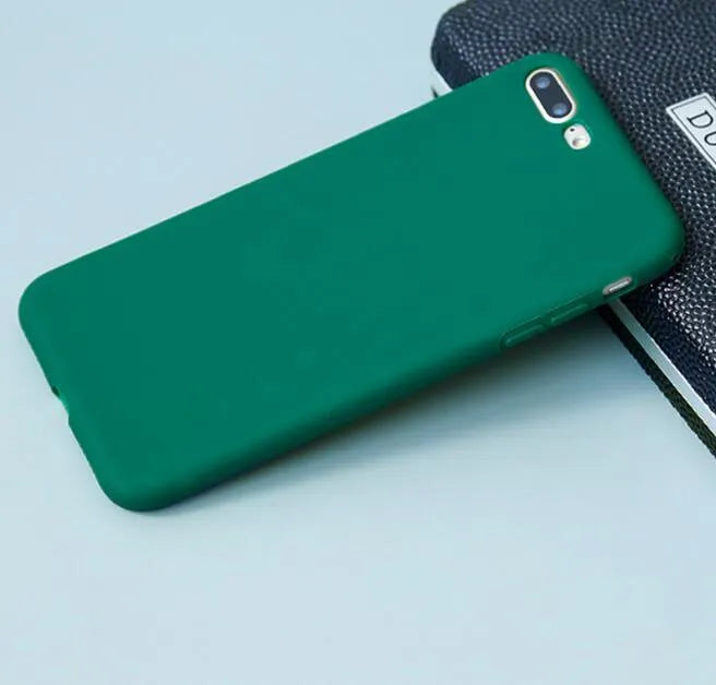 Frosted matte soft phone case for Apple iPhone models on a table.