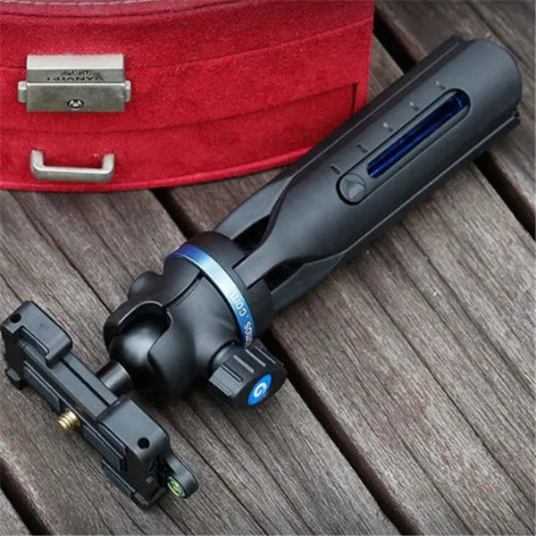 Black aluminium alloy and plastic desktop tripod stand holding a mobile phone.