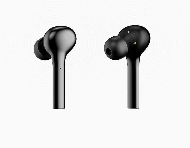 Black and white wireless in-ear Bluetooth headphones with a charging case on a table.