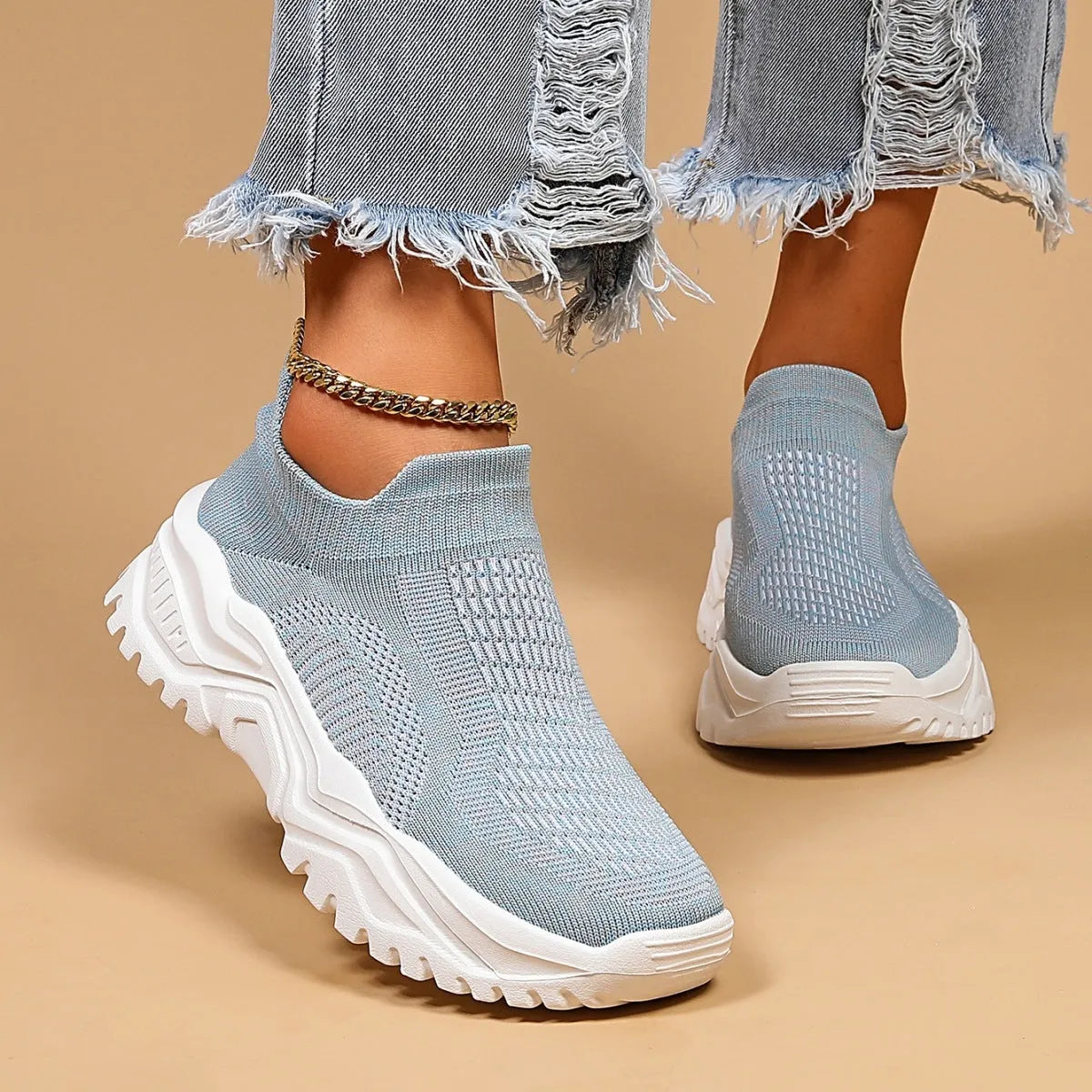 Light blue women's mesh slip-on sports shoes with woven upper and mid heel design