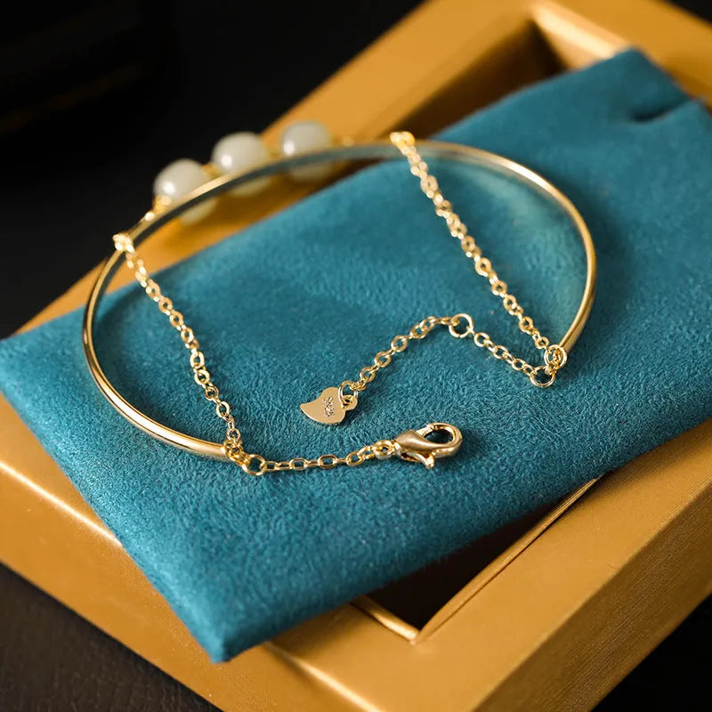 Women's Hetian jade lucky beads bracelet with gold inlay, shown in single, double, and three bead versions.