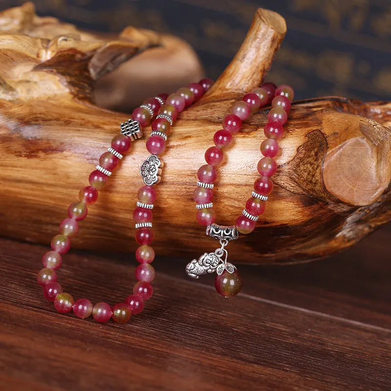 Handmade watermelon crystal bracelet with Chinese knot and geometric beads in 6mm or 8mm sizes.