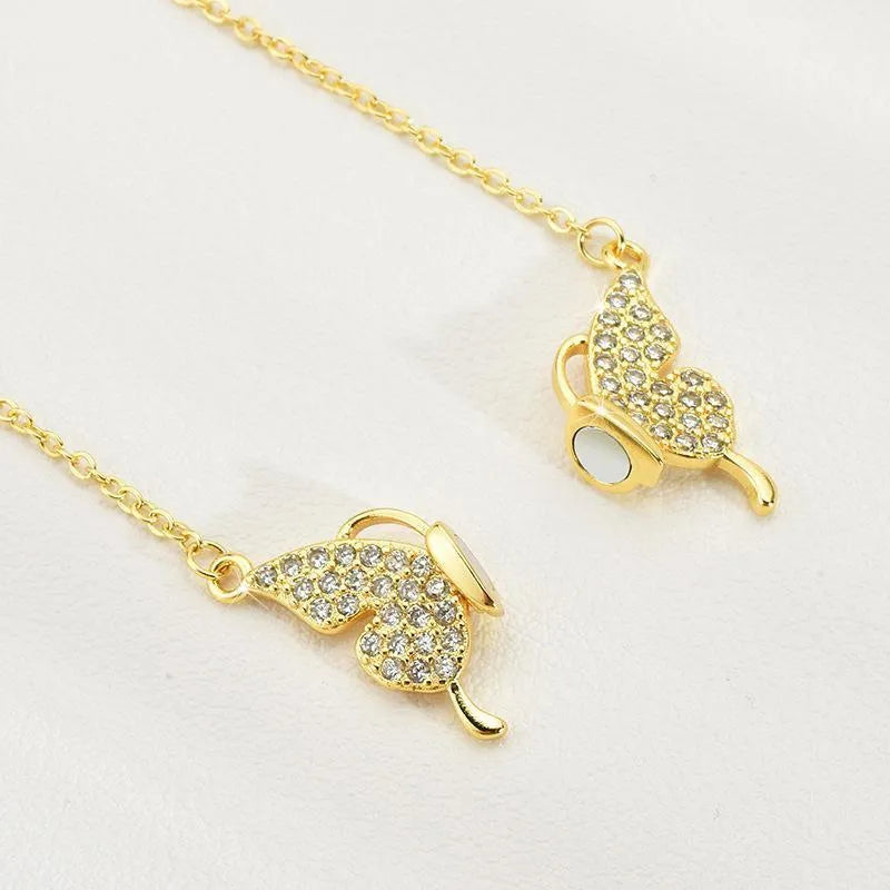 Women's twisted titanium steel clavicle chain with magnetic snap butterfly charm in gold finish