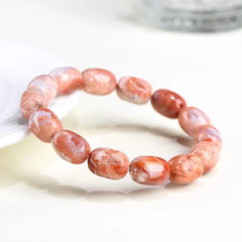 Natural cherry agate barrel bead bracelet with 10x14mm stones and Ruyi design elements