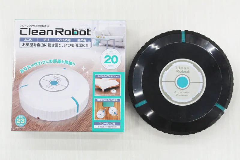 Black or white AC-powered robot vacuum cleaner on a wooden floor.