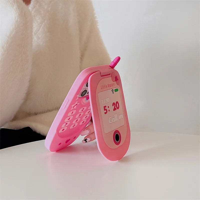 Light pink silicone iPhone case with a built-in cosmetic mirror, showing a cute cartoon design.