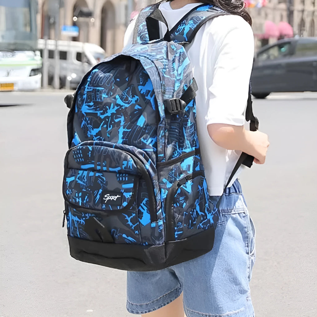 Blue classic nylon backpack with multiple pockets open, showing internal organisers and laptop sleeve.