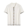 White short sleeve cardigan with dark contrast colour lapels on a hanger.