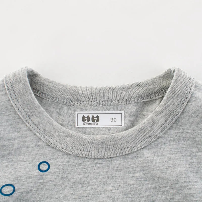 Grey children's cotton T-shirt laid flat, showing a size chart for measurements from 90cm to 140cm.