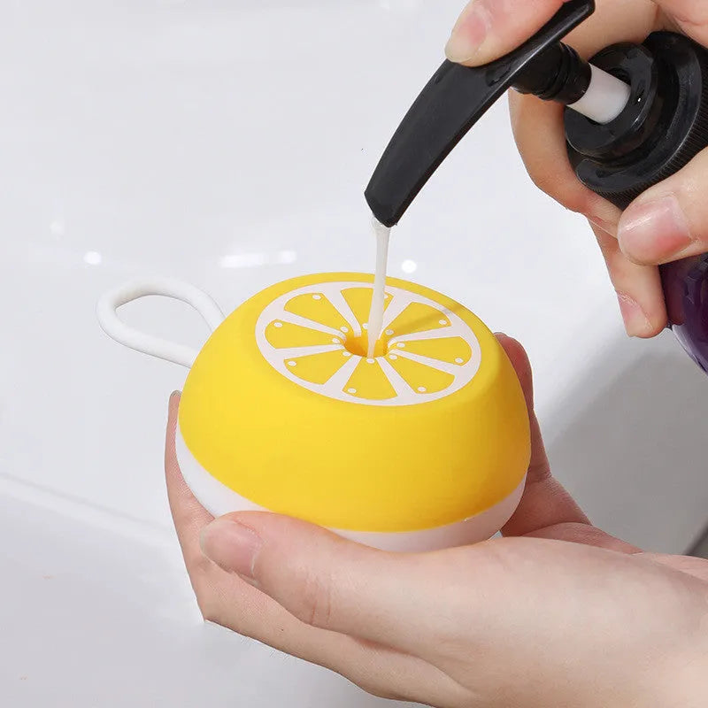 Yellow silicone pet bath brush with soft bristles for dog and cat grooming during bathing