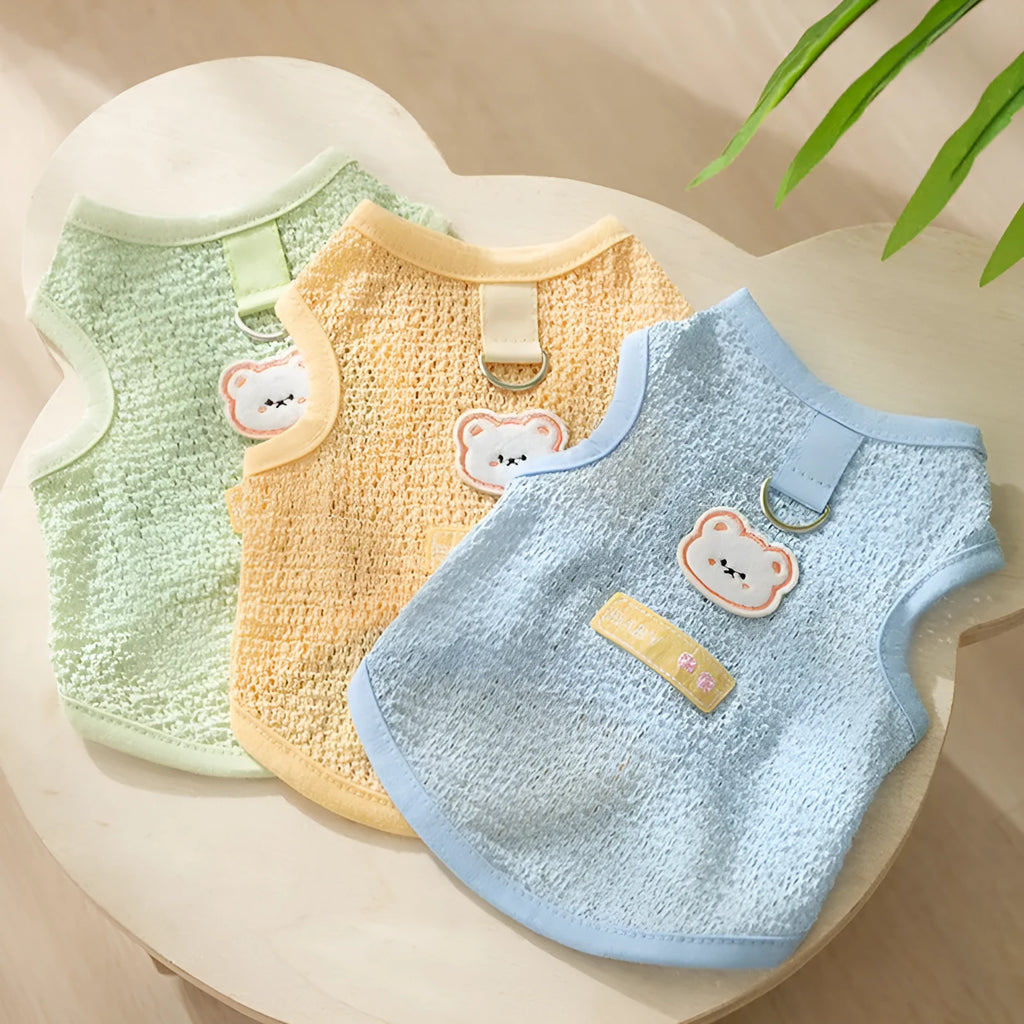 Breathable hollowed-out cat clothes with a cartoon bear patch in blue.
