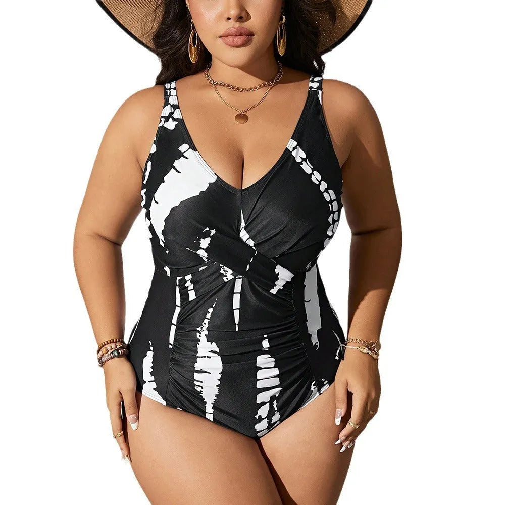 Black conservative one-piece swimsuit on a mannequin, showing sleeveless design and Siamese colour matching pattern.