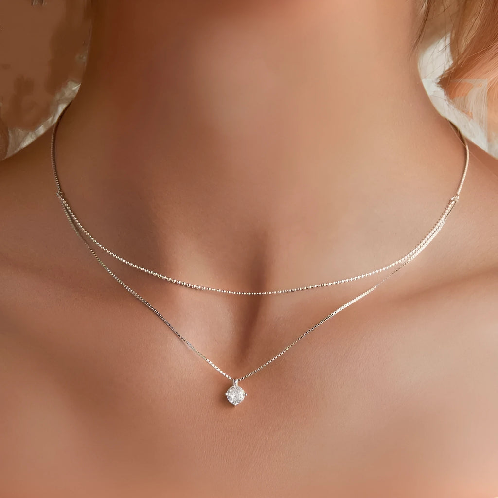 S925 sterling silver double layer necklace with pearl chain and silver alloy pendant.
