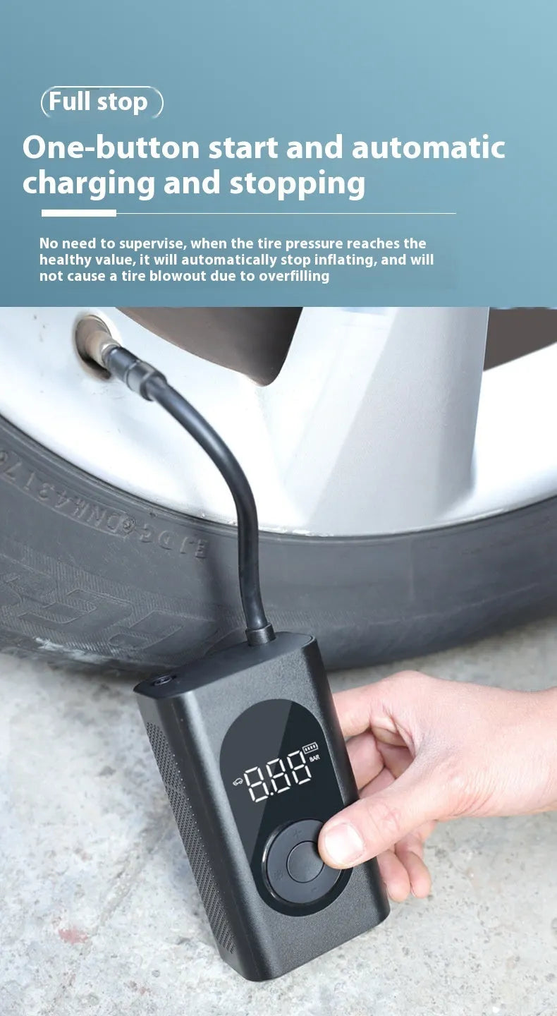 Compact black handheld wireless tyre inflator with digital display, attached air hose, and USB cable.